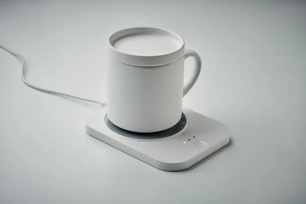 Witte elektrische mokverwarmer met koffiemok
